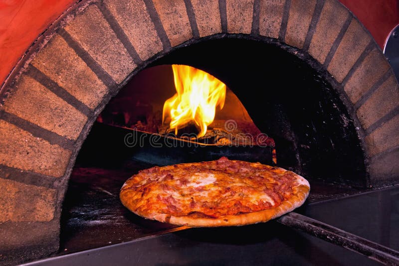 Pizza baking in the oven stock image. Image of indoor 18724383
