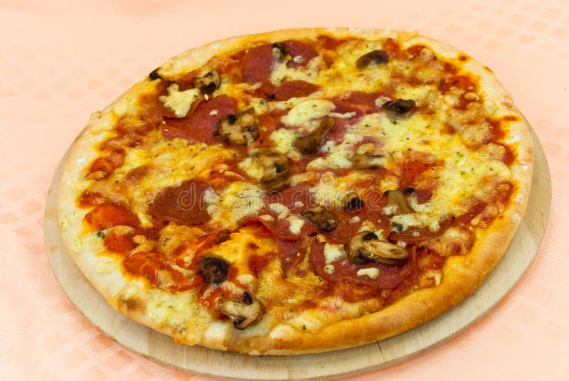 A pizza with cheese,salami - slices