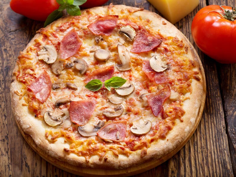Pizza with Ham and Salami with Ingredients for Cooking Stock Image