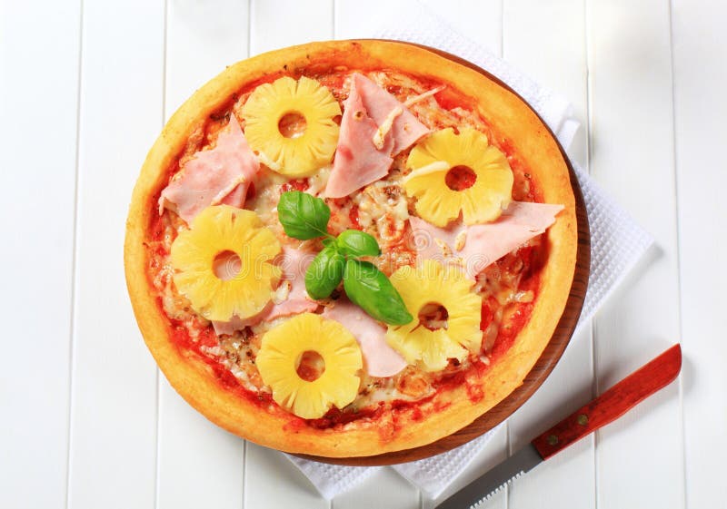 Pizza with pieces of ham and pineapple. Pizza with pieces of ham and pineapple