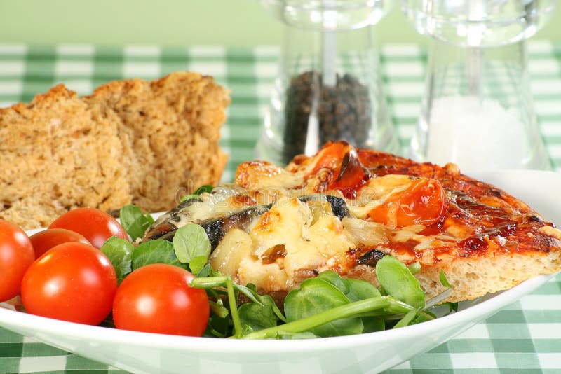 Vegetarian pizza with tomatoes and water cress. Vegetarian pizza with tomatoes and water cress