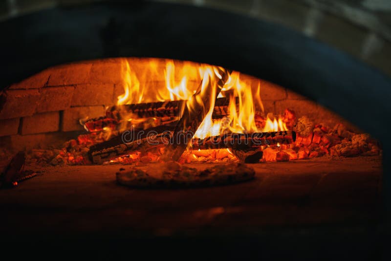 Pizza in the Oven. Cooking Pizza in the Pizzeria Stock Photo Image of