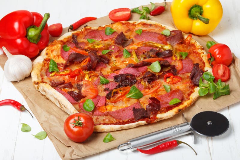 Pizza with salami and ham stock image. Image of fast 186796419