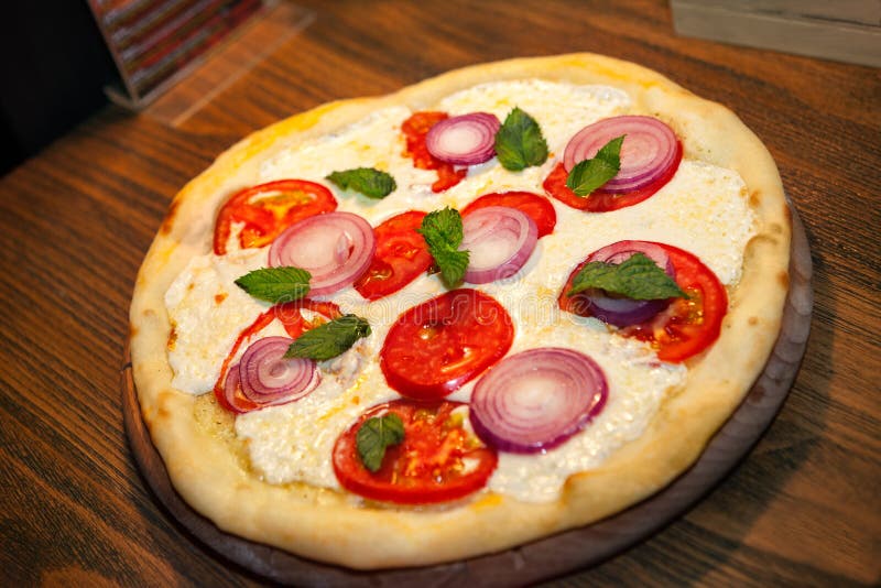Pizza in shape of circle stock image. Image of cheddar 81645587