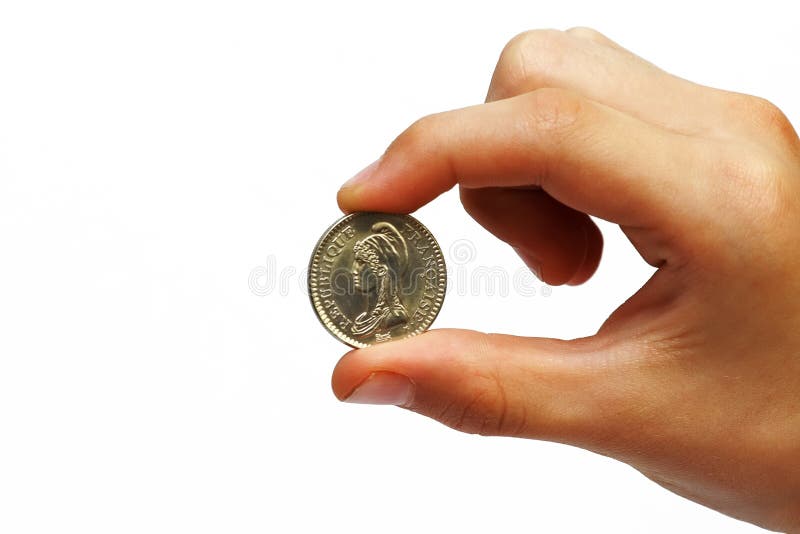 Photo of the coin in a man's hand on white background. Photo of the coin in a man's hand on white background