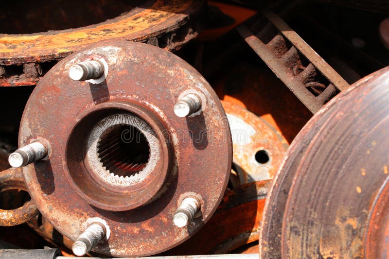 Automobile parts discarded in a bin. Wheel hubs, brake disks, spline shaft opening shown. Automobile parts discarded in a bin. Wheel hubs, brake disks, spline shaft opening shown.