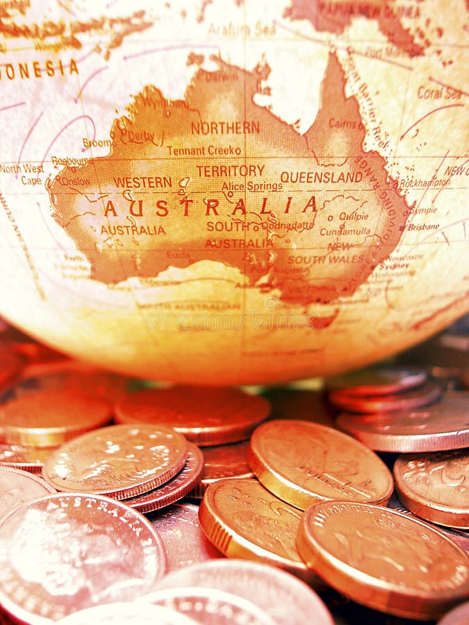 Pièces de monnaie et globe australiens image libre de droits Pièces de monnaie et globe australiens image libre de droits