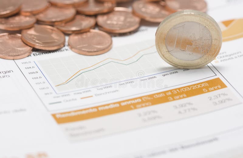 Coins pile, euro on edge and stock market graph. Coins pile, euro on edge and stock market graph