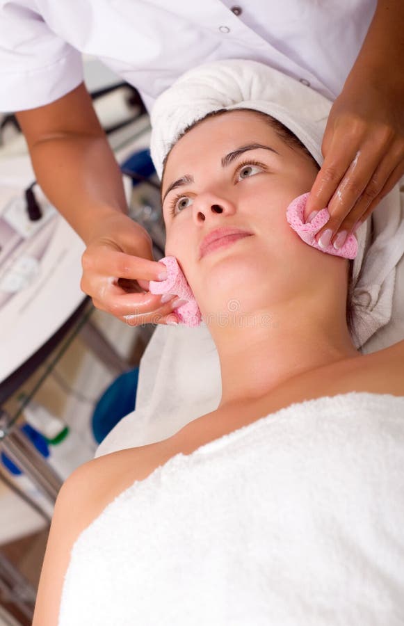 Young woman getting skin cleaning at beauty salon (shallow dof). Young woman getting skin cleaning at beauty salon (shallow dof)