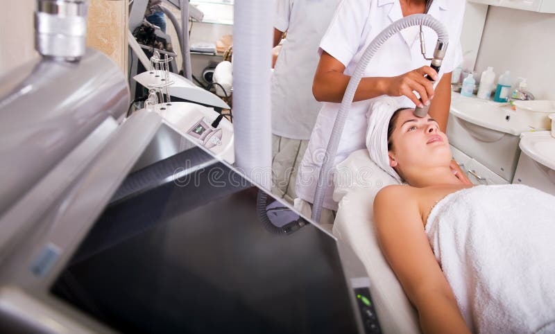 Woman getting skin cleaning at beauty salon. Woman getting skin cleaning at beauty salon