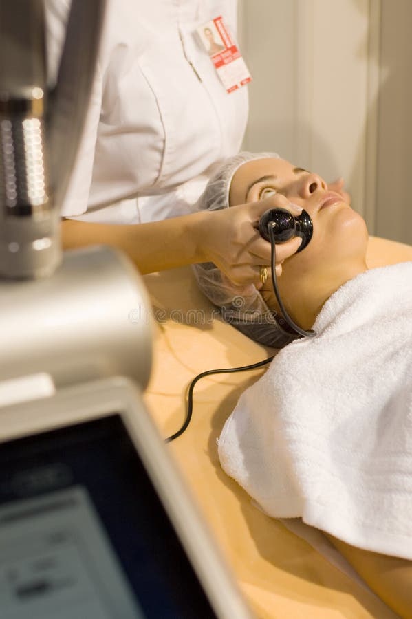 Young woman getting skin cleaning at beauty salon, vacuum therapy. Young woman getting skin cleaning at beauty salon, vacuum therapy