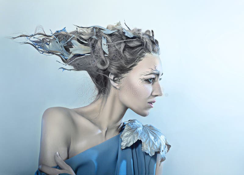 Beatiful high fasion female model with fantasy hair style and art make up nature concept. Beatiful high fasion female model with fantasy hair style and art make up nature concept