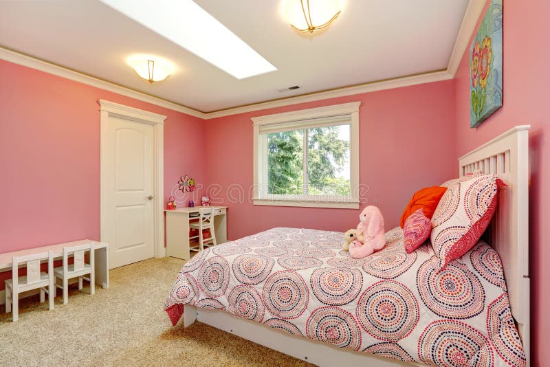 Cozy and gentle colors bedroom for girls. Pink walls blend with bedding. Cozy and gentle colors bedroom for girls. Pink walls blend with bedding.