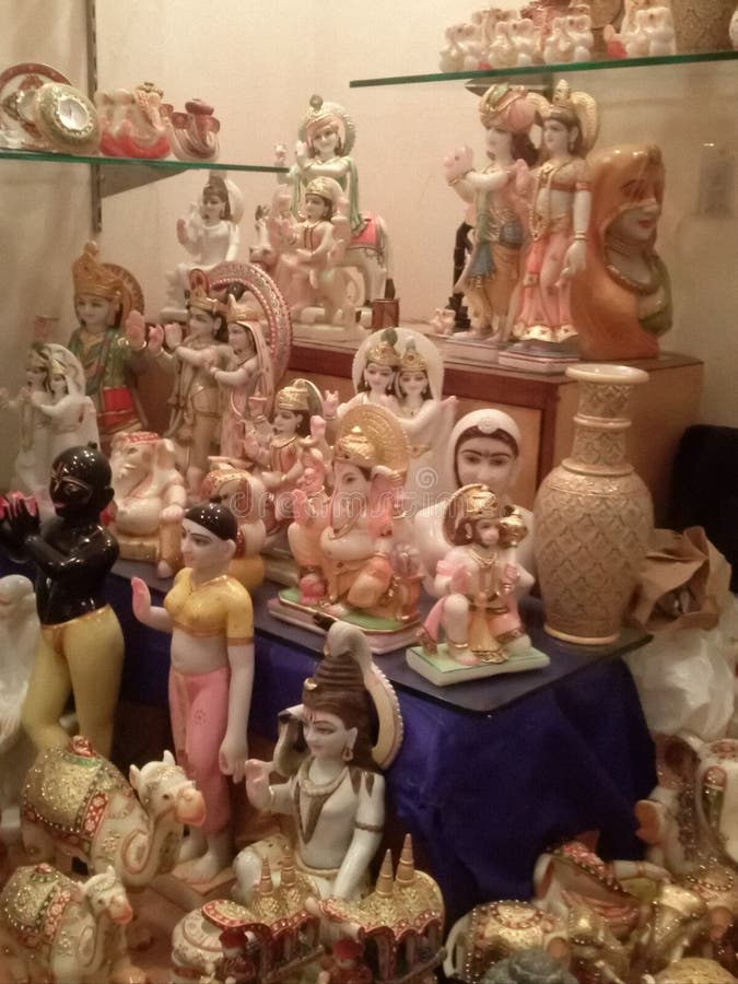 This image shows beautiful idols of Hindu gods made of clay.  Terracotta camels and pot are also seen in the picture. This image shows beautiful idols of Hindu gods made of clay.  Terracotta camels and pot are also seen in the picture.