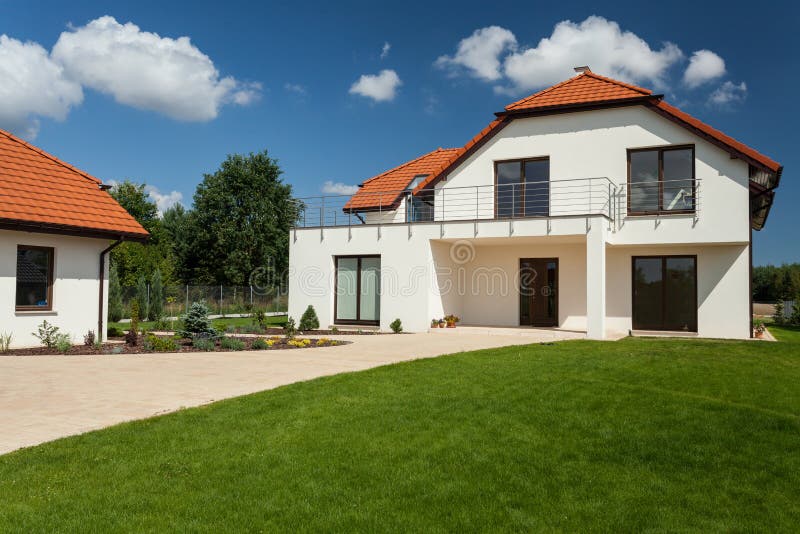 View of beautiful modern house with outbuilding. View of beautiful modern house with outbuilding