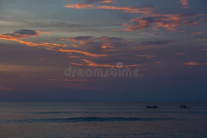 Silhouette of fishermen on the fishing boat during sunset. Silhouette of fishermen on the fishing boat during sunset