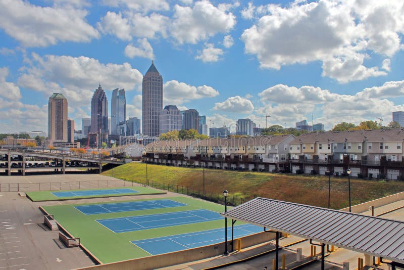 A beautiful view of modern buildings on the background of sport courts. A beautiful view of modern buildings on the background of sport courts