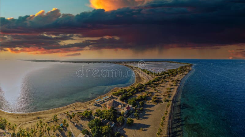 A beautiful sunset with a dramatic cloudy sky in front of the sea, Playa Salinas Beach, Bani, Dominican Republic. A beautiful sunset with a dramatic cloudy sky in front of the sea, Playa Salinas Beach, Bani, Dominican Republic