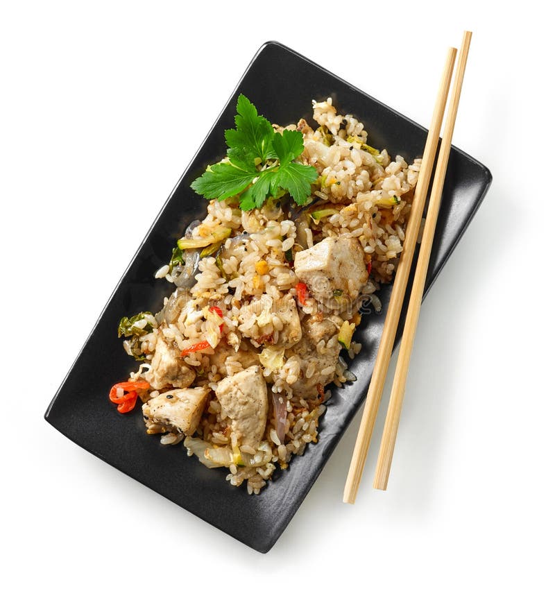 Plate of asian food, fried rice with chicken and vegetables isolated on white background, top view. Plate of asian food, fried rice with chicken and vegetables isolated on white background, top view