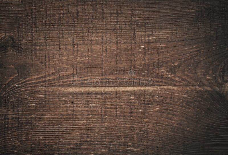 Tábua de corte de madeira escura e riscada. Madeira imagem de stock royalty free