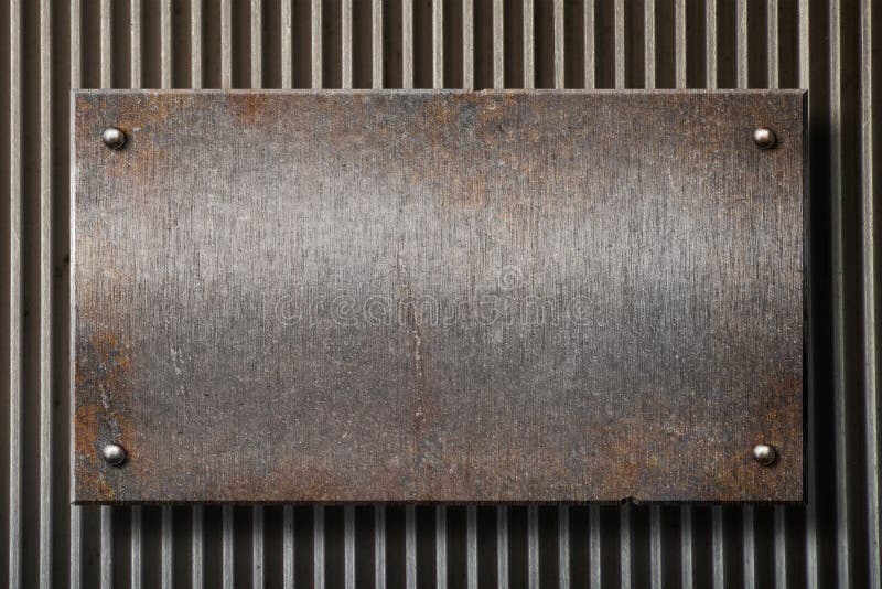 Placa de metal oxidada de Grunge sobre o fundo da grade