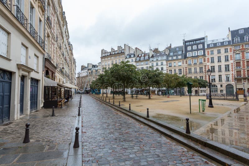 Place Square Dauphine Paris, France under the rain