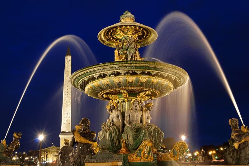 The rivers fountain (Fontaine des Fleuves) in Place de la Concorde by night in Paris, France. Selective focus. The rivers fountain (Fontaine des Fleuves) in Place de la Concorde by night in Paris, France. Selective focus.