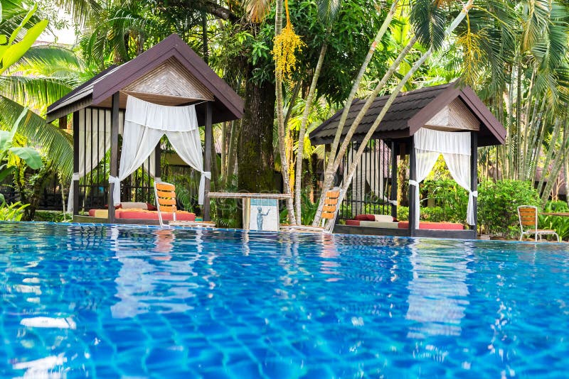 Place for Thai massage at beautiful swimming pool in tropical re royalty free stock photography Place for Thai massage at beautiful swimming pool in tropical re royalty free stock photography