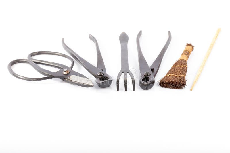Placez des outils pour cultiver des bonsaïs d'isolement photographie stock Placez des outils pour cultiver des bonsaïs d'isolement photographie stock