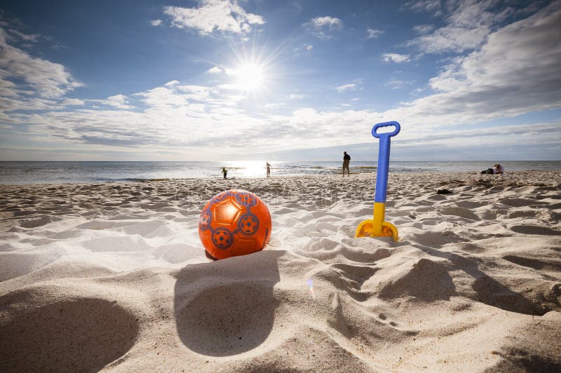 Beach toys for kids, colorful beach toys in the sun. Beach toys for kids, colorful beach toys in the sun.