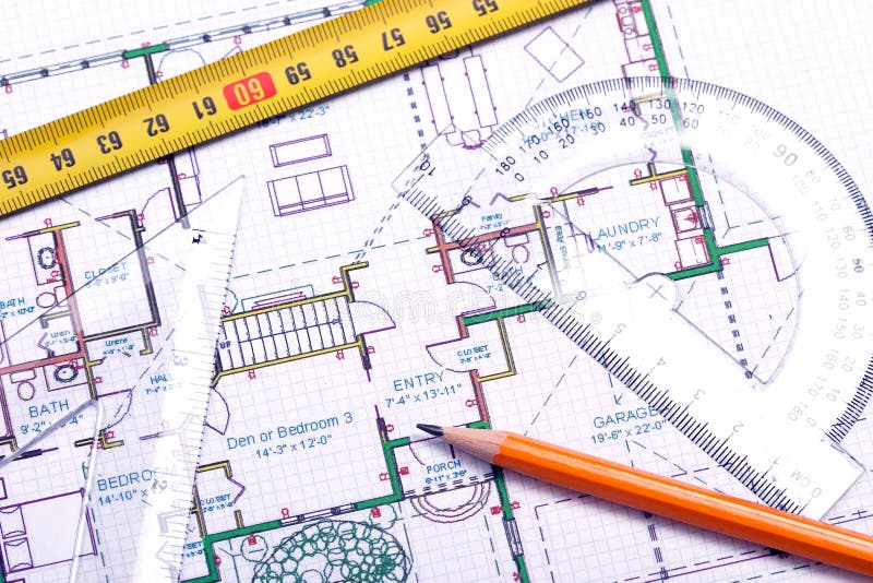 Topview of a tape measure, pencil and other tools on top of floor plan. Topview of a tape measure, pencil and other tools on top of floor plan