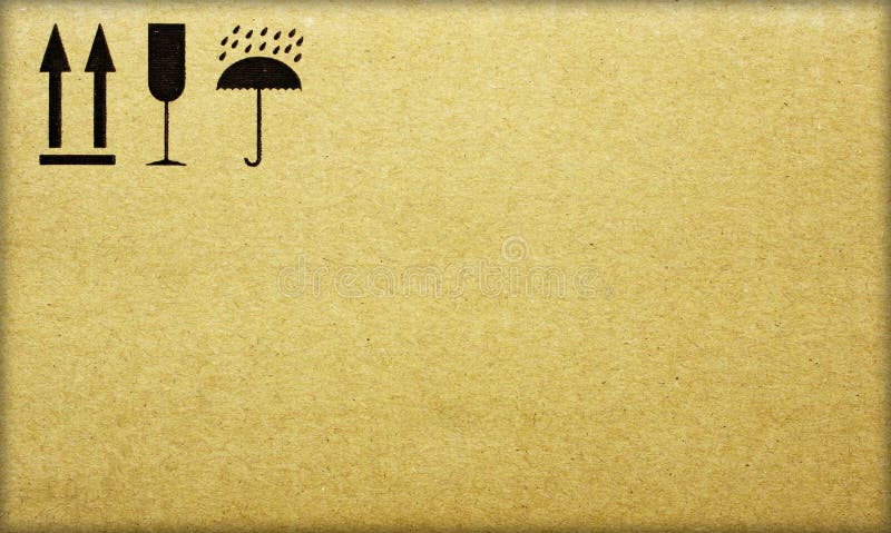 Plan rapproché fin d'image de symbole fragile noir grunge sur le carton images stock Plan rapproché fin d'image de symbole fragile noir grunge sur le carton images stock