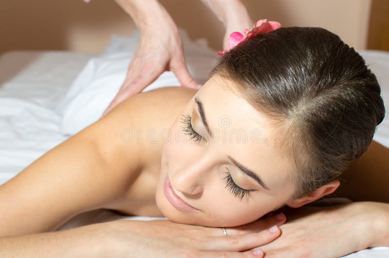 woman lying on a table and taking beauty massages procedure closeup image. woman lying on a table and taking beauty massages procedure closeup image