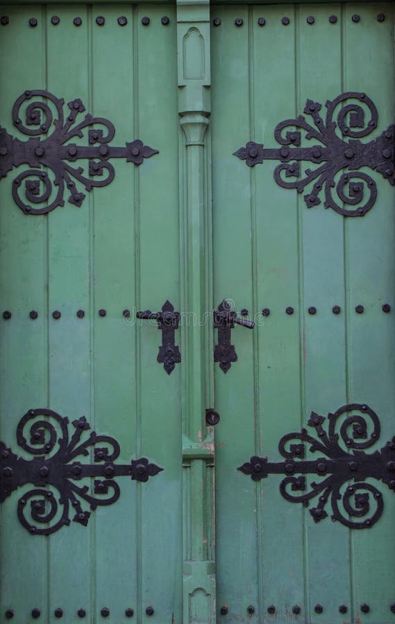 Vintage old retro wooden green door close up, architecture details. Vintage old retro wooden green door close up, architecture details