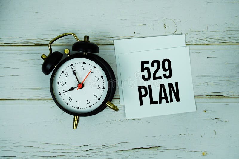 529 Plan text message on paper with alarm clock on wooden background royalty free stock photography