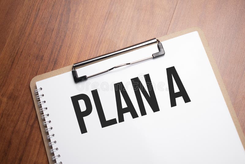 Plan a text on white paper on the wood table stock photos