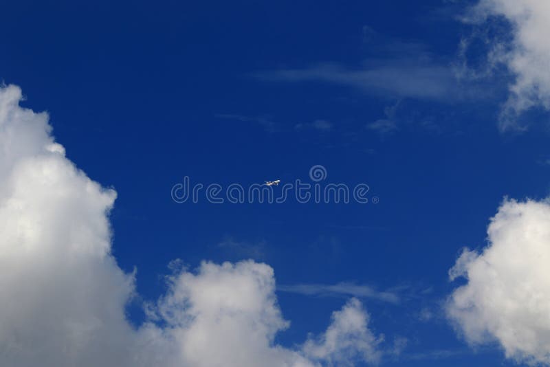 A plane fly on blue sky and white cloud. royalty free stock images A plane fly on blue sky and white cloud. royalty free stock images