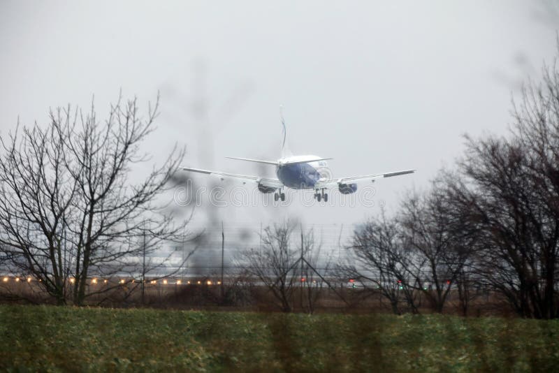 Plane landing on runway editorial stock image. Image of headquartered ...