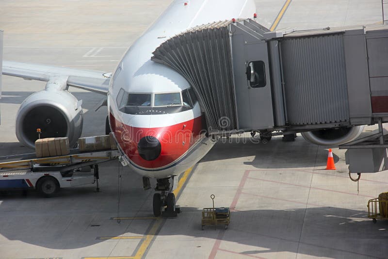 Plane Loading Cargo and Passengers Boarding stock photography Plane Loading Cargo and Passengers Boarding stock photography