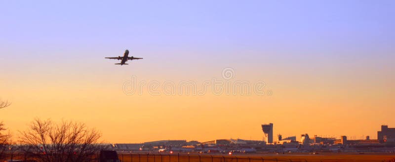 Plane Taking Off at Sunset at Philadelphia Airport stock photo Plane Taking Off at Sunset at Philadelphia Airport stock photo