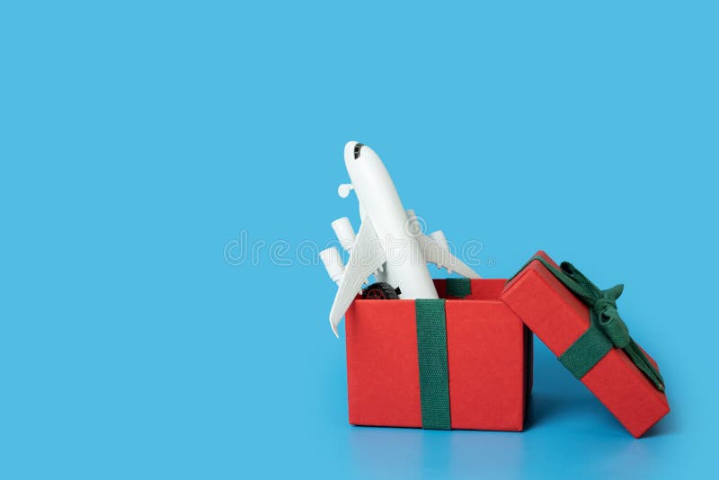 Plane Tickets Gift for the Holiday, Airplane in a Gift Box Stock Image