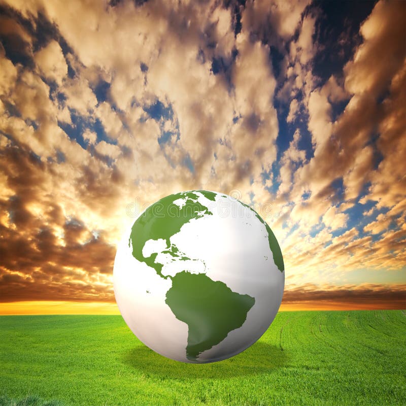 Planet Earth model on green field royalty free stock photography
