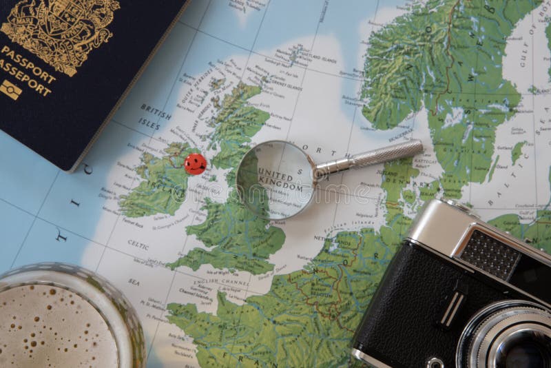 Planning a trip to Ireland on a world map with accessories. Planning a trip to Ireland on a world map with accessories.