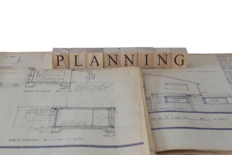 Planning written on wooden blocks on house extension building plans blueprints royalty free stock photo Planning written on wooden blocks on house extension building plans blueprints royalty free stock photo