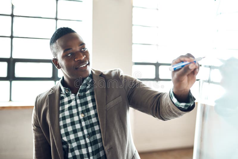 He Plans Hard for Success. a Businessman Using a Whiteboard during a