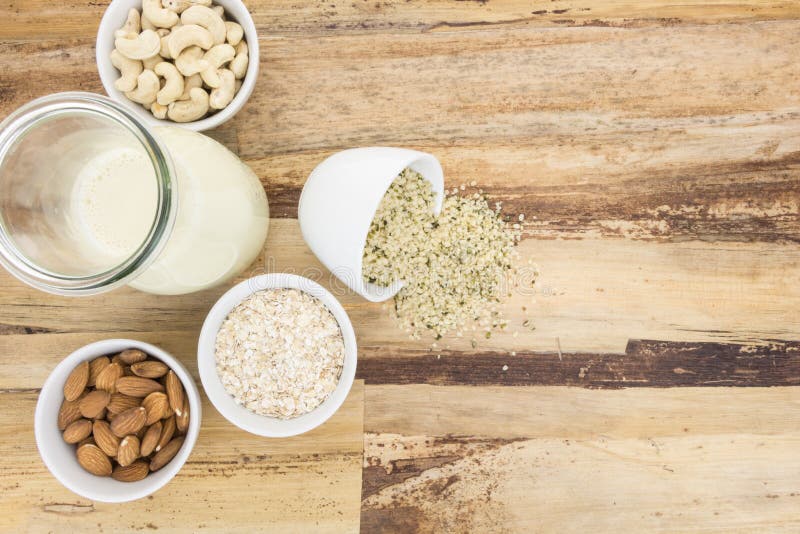 Plant based milk and and bowls with ingredients