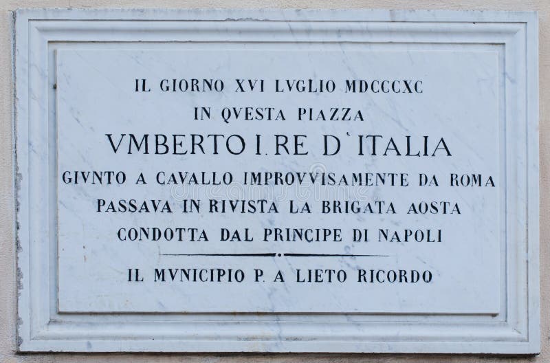 MANZIANA, ITALY - OCTOBER 15, 2016: Memorial plaque in Tommaso Tittoni Square remembering that here, in 1880, Umberto I, king of Italy was reviewing the Aosta Brigade conducted by the Prince of Naples. MANZIANA, ITALY - OCTOBER 15, 2016: Memorial plaque in Tommaso Tittoni Square remembering that here, in 1880, Umberto I, king of Italy was reviewing the Aosta Brigade conducted by the Prince of Naples.