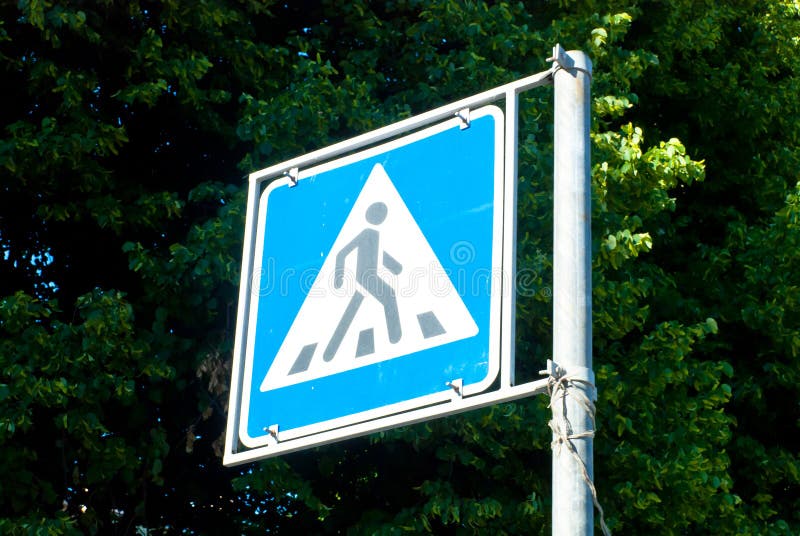 A crosswalk street sign in downtown Saint Petersburg, Russia. A crosswalk street sign in downtown Saint Petersburg, Russia.