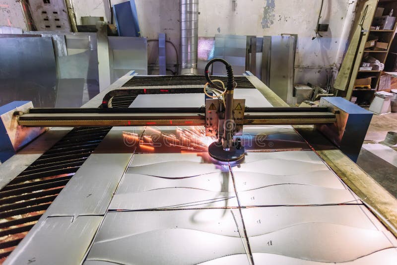 Plasma Cut Machine with Program Control Cutting Steel Sheet with Sparks in Metalwork Factory
