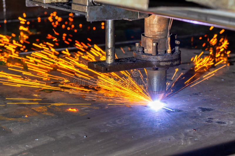 A plasma cutting machine cuts large and thick steel sheets. Lots of bright red sparks and smoke. Closeup machine tool stock images, royalty-free photos and pictures